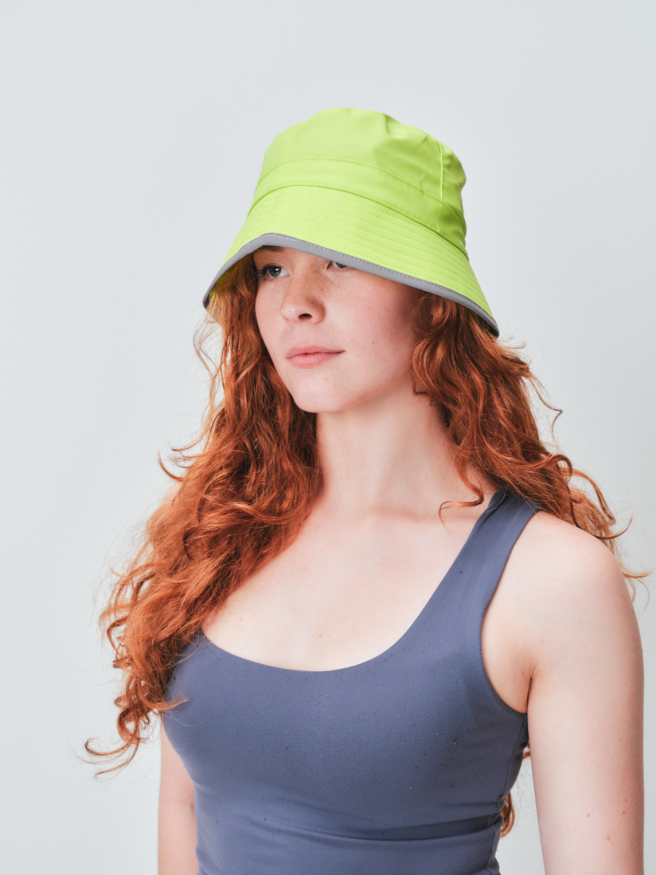 RAINS reflective lime bucket hat